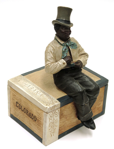 Maresch, Johann, skulptur/tobaksskrin, bemålat lergods, 1800-talets slut, i form av sittande afrikansk man på cigarrlåda Haban/Colorado,_1710a_8d8436fce7327cd_lg.jpeg